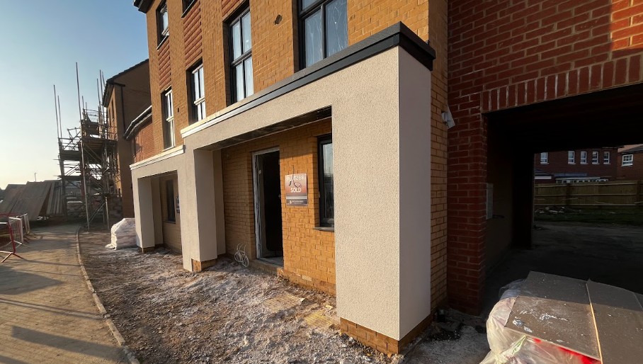 Premium detached UK home with high-performance white monocouche render finish applied by Namis Facades