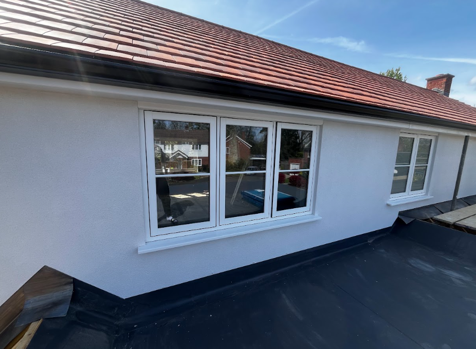 Rainwater beading up on water-repellent and breathable silicone thin-coat render surface, proving its moisture resistance
