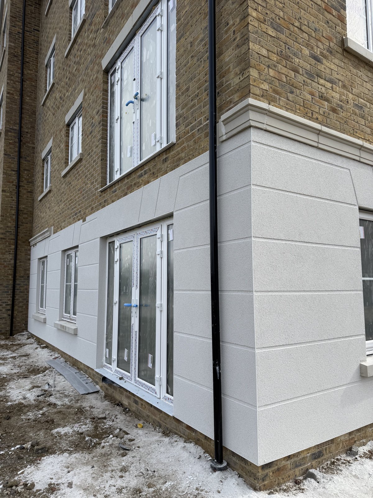 Monocouche spray render with ashlar effect project by Namis Facades in Wokingham